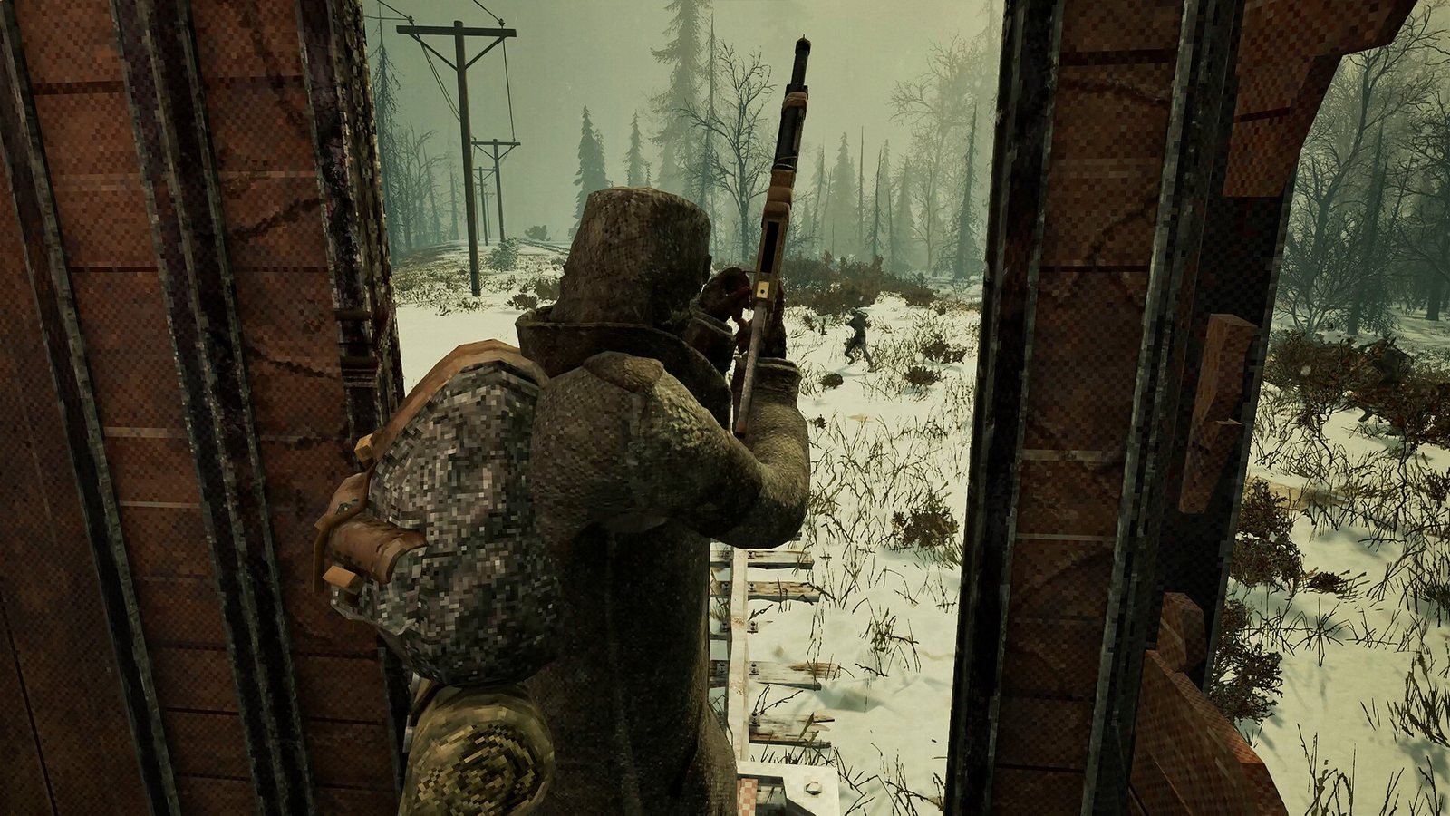 A lone survivor with a rifle at the edge of a ruined structure in the snow