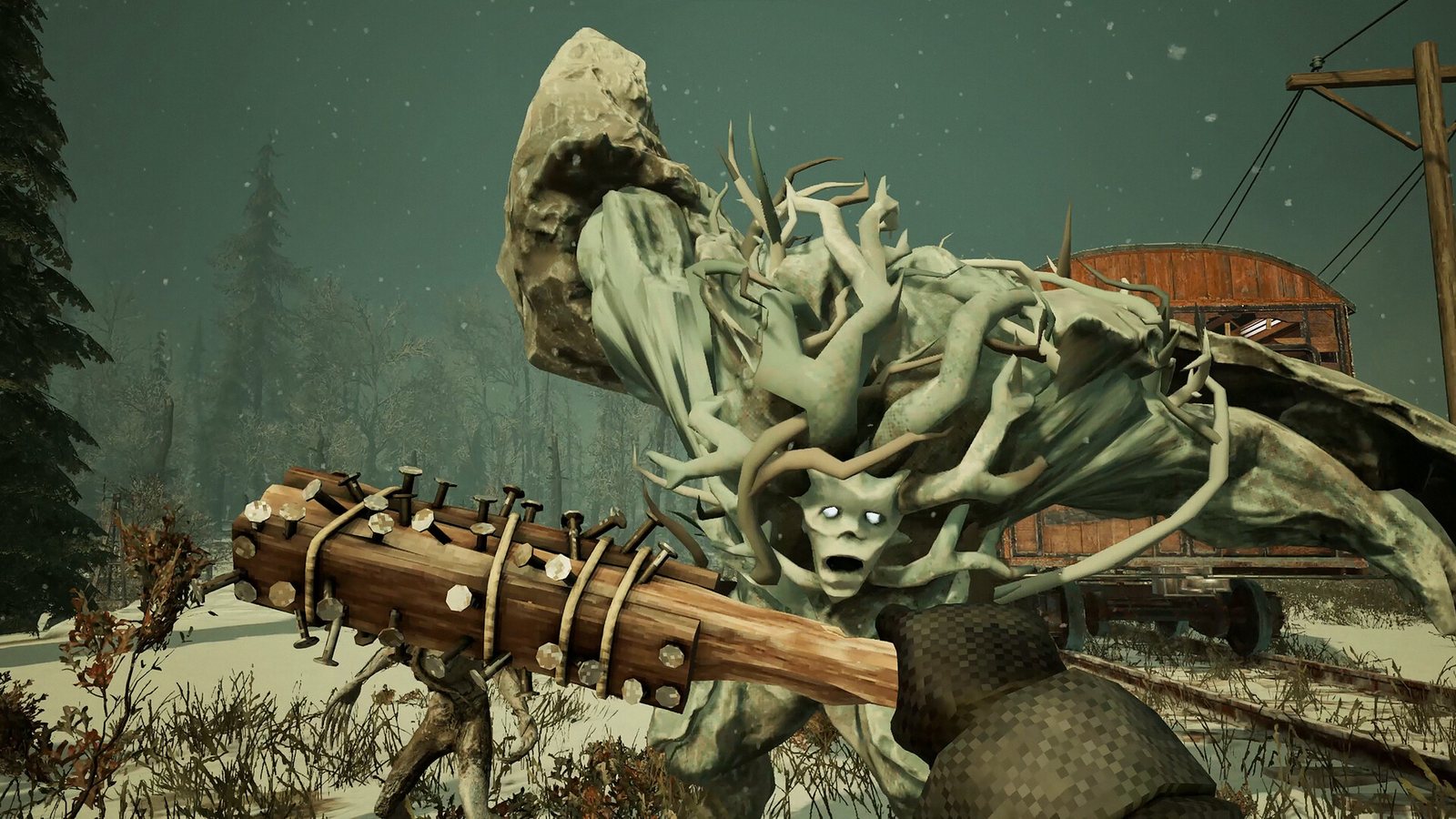 A tall antlered Revenant standing over a wooden structure in the snow