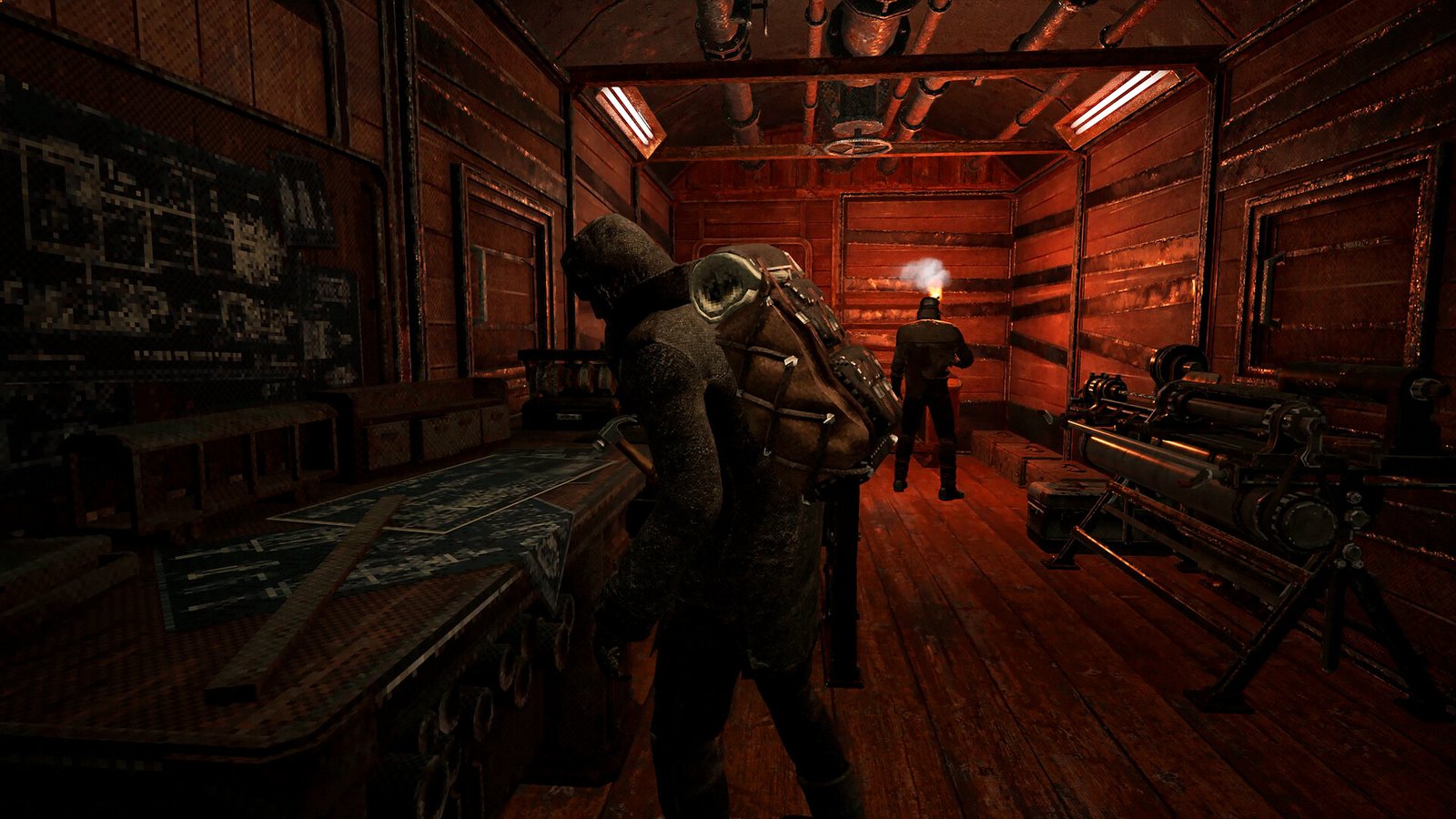 A survivor studying a wall map inside a timber-and-pipe interior