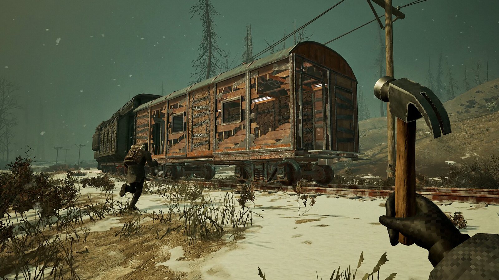 A passenger carriage standing in deep snow with a figure approaching it